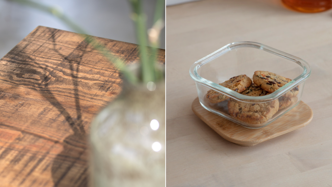 Wooden table close up and small glass container with cookies in.