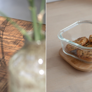 Wooden table close up and small glass container with cookies in.
