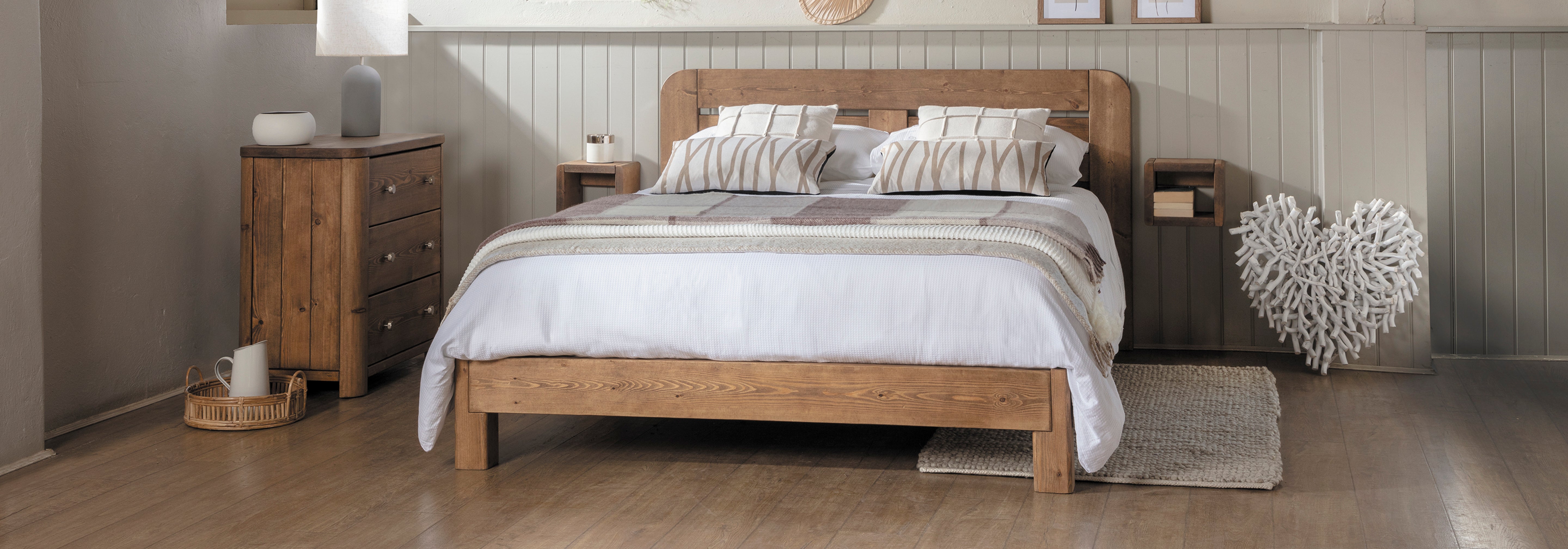 gosforth contemporary solid wooden bedroom with tongue and groove panelling behind it