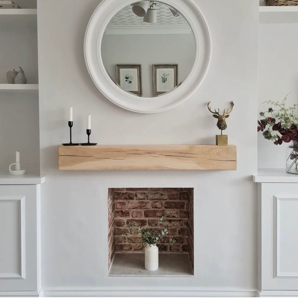 Floating wooden mantel beam on wall