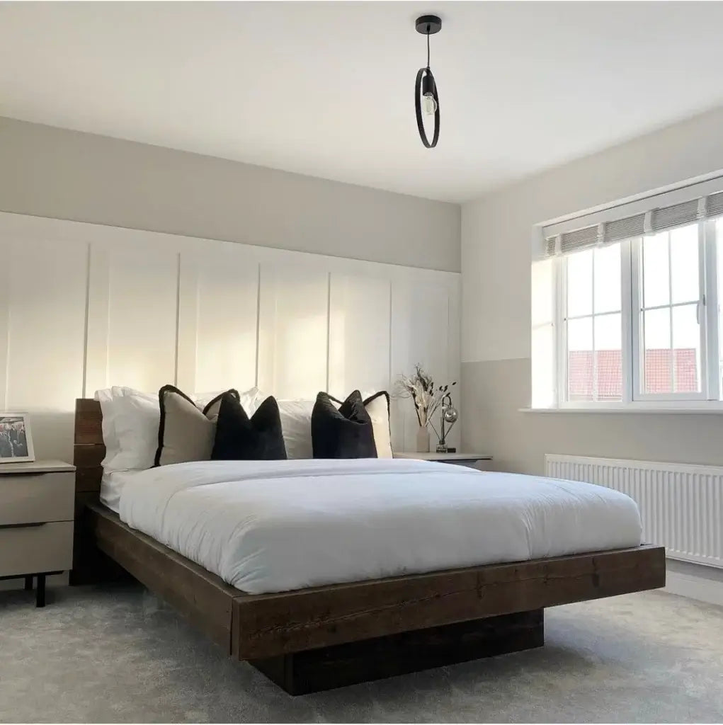 Wooden bed frame in bedroom