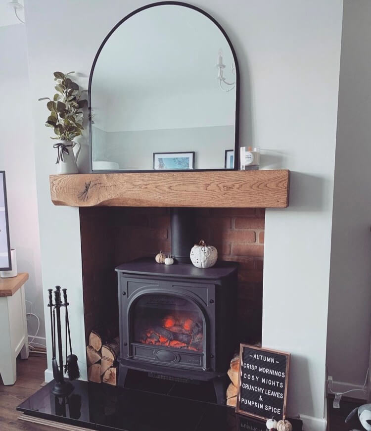 Chunky mantel beam above fireplace