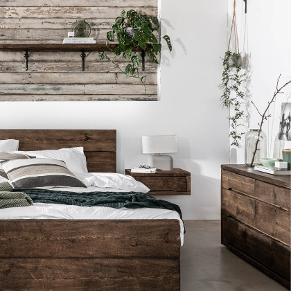 Dark wood bed frame in bedroom