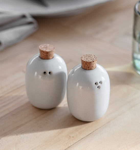 White ceramic salt shop and pepper shakers