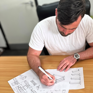 A picture of our furniture designer Matt making sketches of some of the furniture in a new furniture collection.